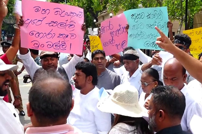 Three Groups Stage Simultaneous Protests Over Treasury's USD 2.5M Cyber Heist
